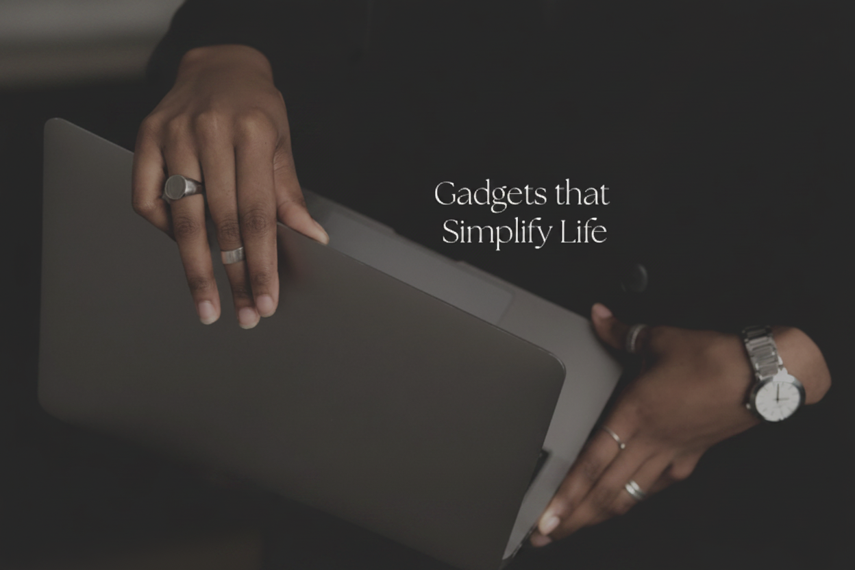 Person holding a laptop with text 'Gadgets that Simplify Life' on a dark background